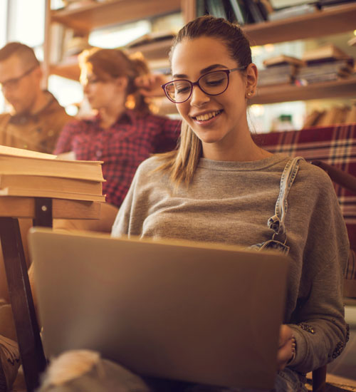 Female student using her laptop.